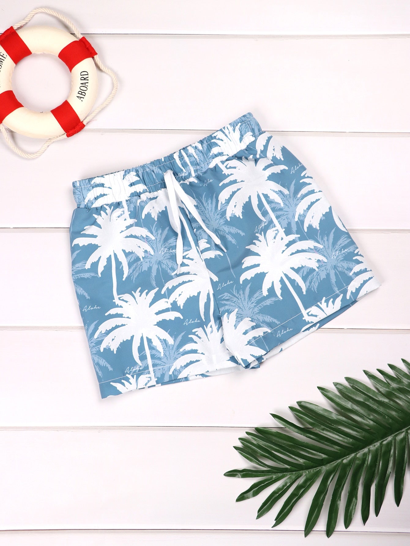 Young Boy Palm Tree Print Swim Trunks