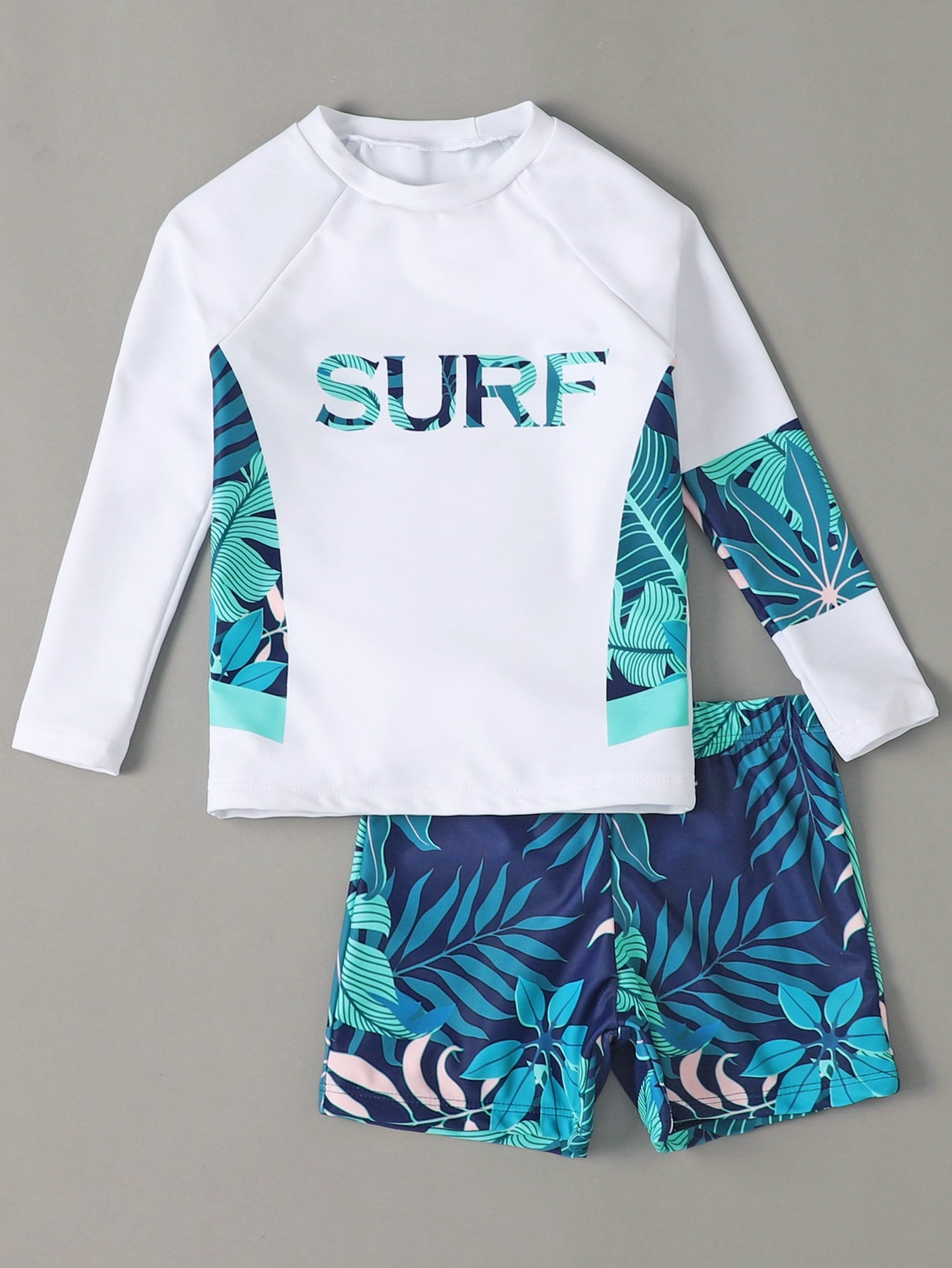 Young Boy Surfing Theme Print Raglan Sleeve Top And Random Print Swim Shorts Set