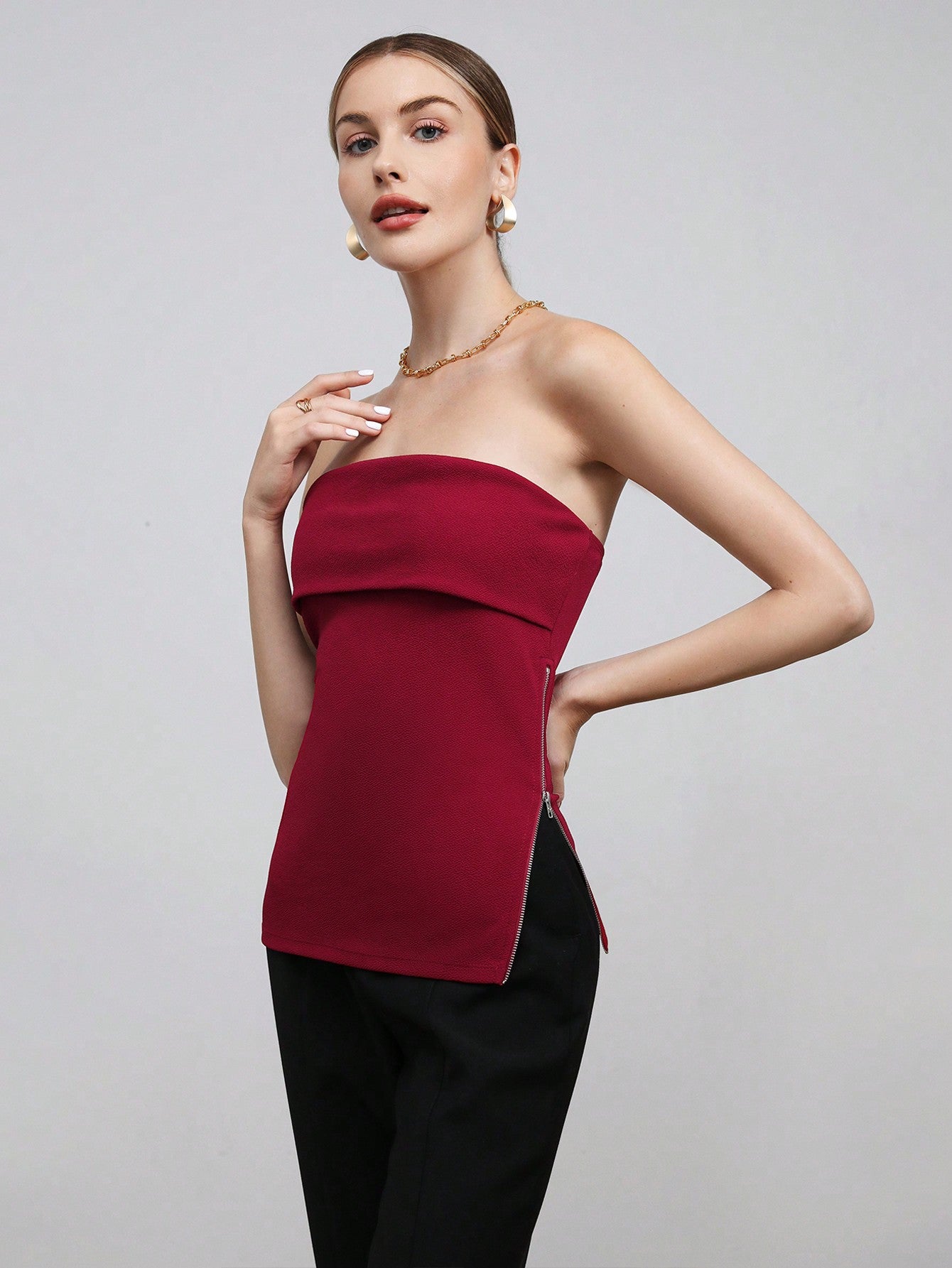 BIZwear Solid Color Side Zipper Crop Top With Strapless Design And Side Slit