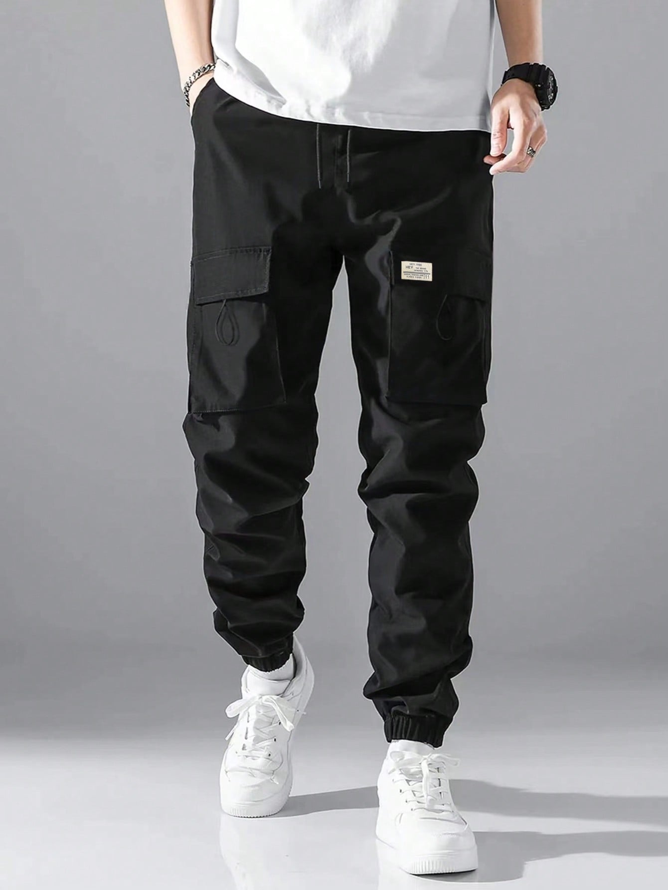 Loose Fit Men's Cargo Pants With Letter Patching, Flap Pockets, And Drawstring Waist