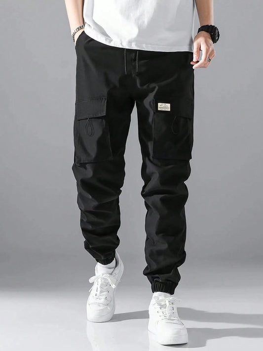 Loose Fit Men's Cargo Pants With Letter Patching, Flap Pockets, And Drawstring Waist