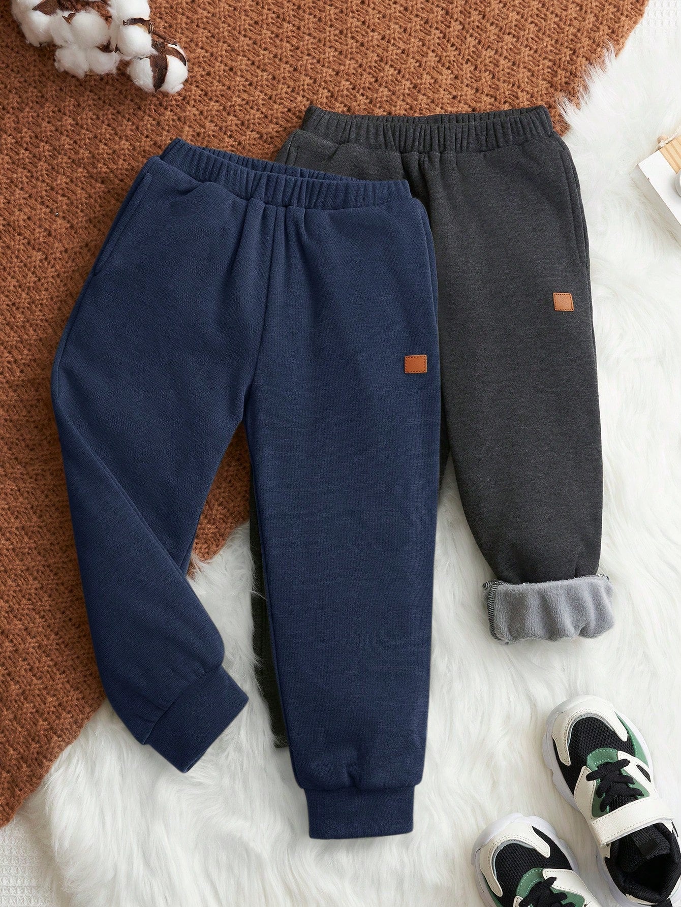 Young Boy Casual Solid Color Jogger Pants With Slanted Pockets And Elastic Cuffs