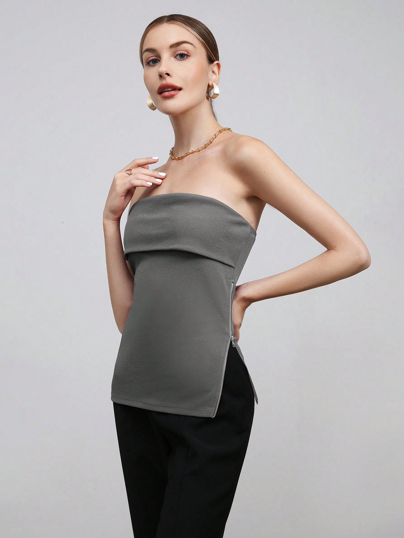 BIZwear Solid Color Side Zipper Crop Top With Strapless Design And Side Slit