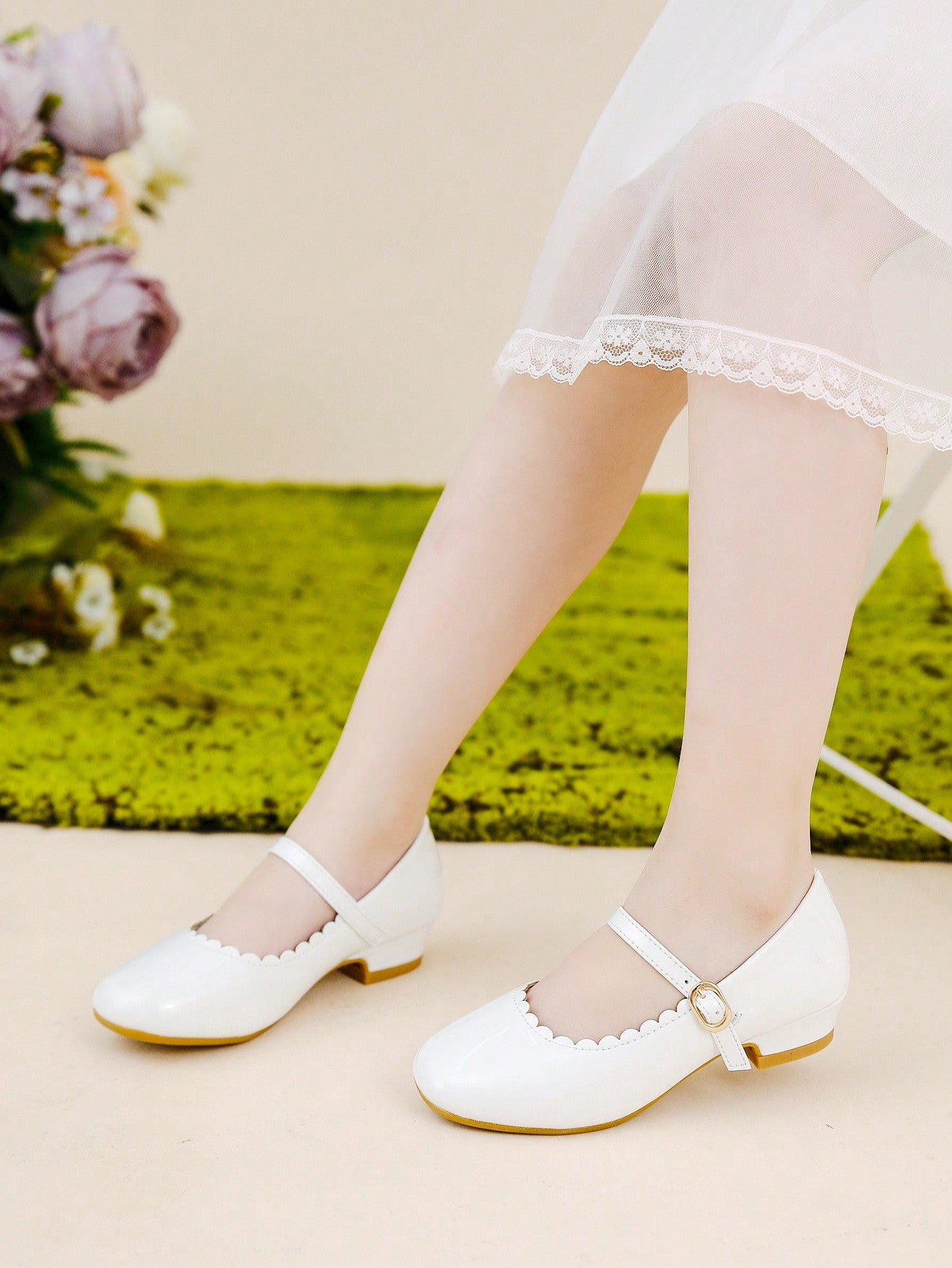 A Pair Of Mary Jane Shoes With Black Bowknot Decoration Matched With A Dress For Children