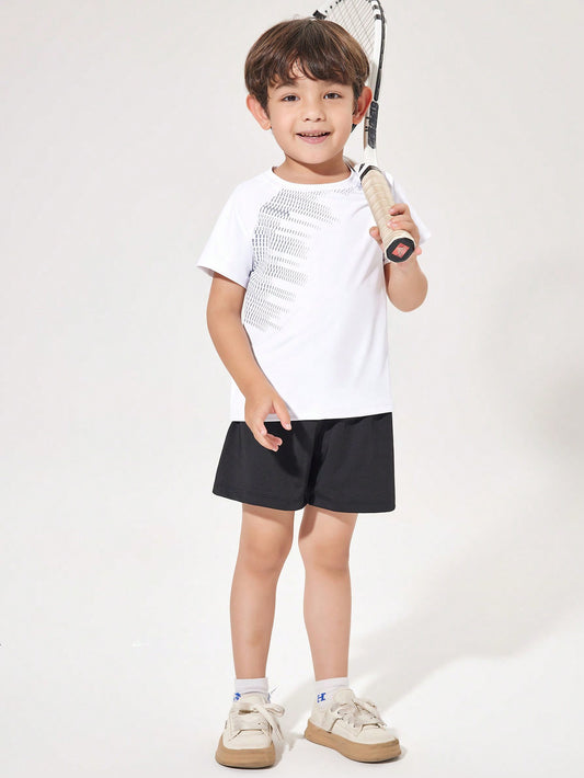 Young Boy Athletic Raglan Sleeve Short Sleeve T-Shirt And Shorts Set