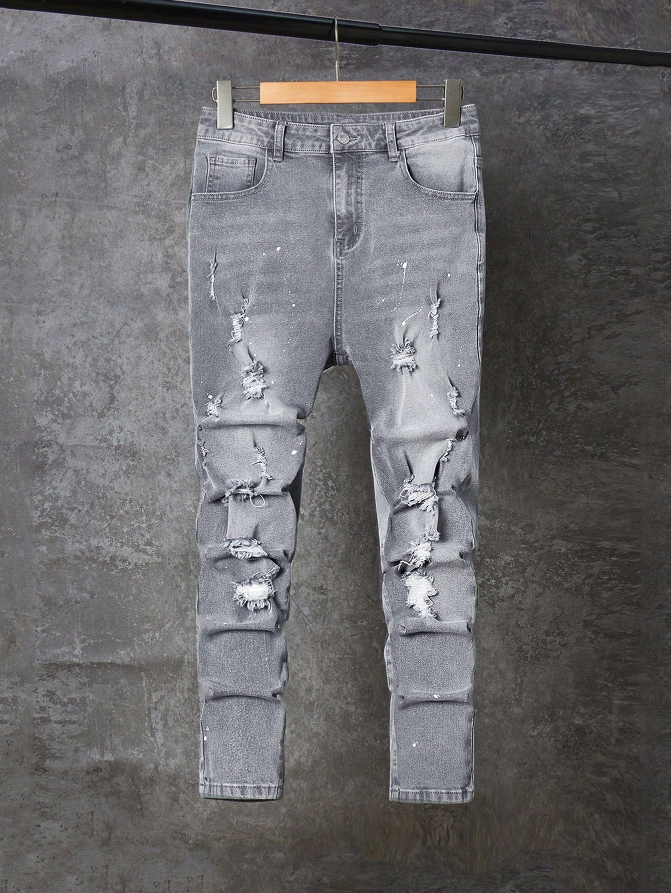 Teen Boy Ripped And Paint-Splattered Jeans