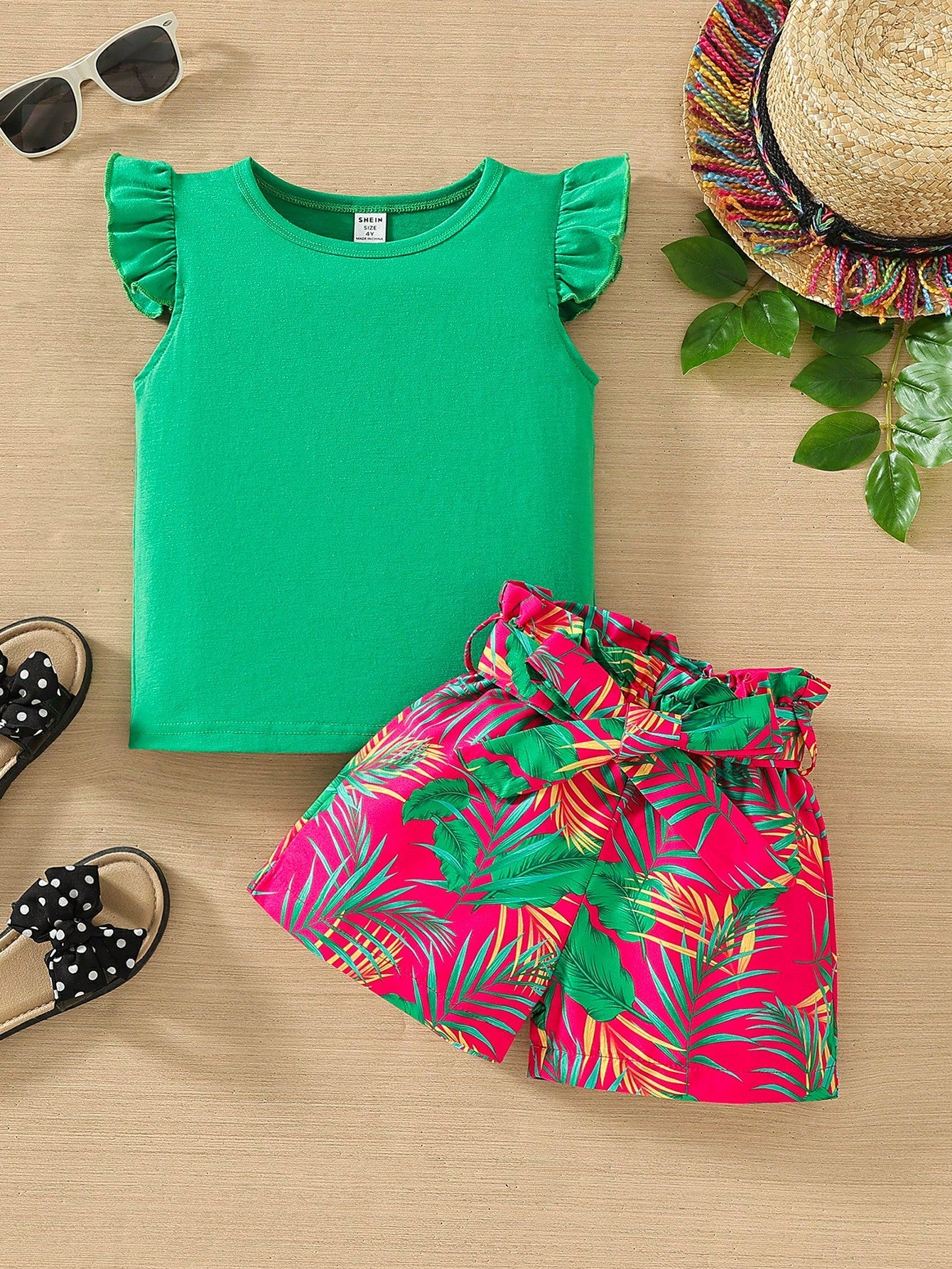 Young Girl Summer Vacation Solid Color Short Sleeve Top And Tropical Print Shorts Outfit