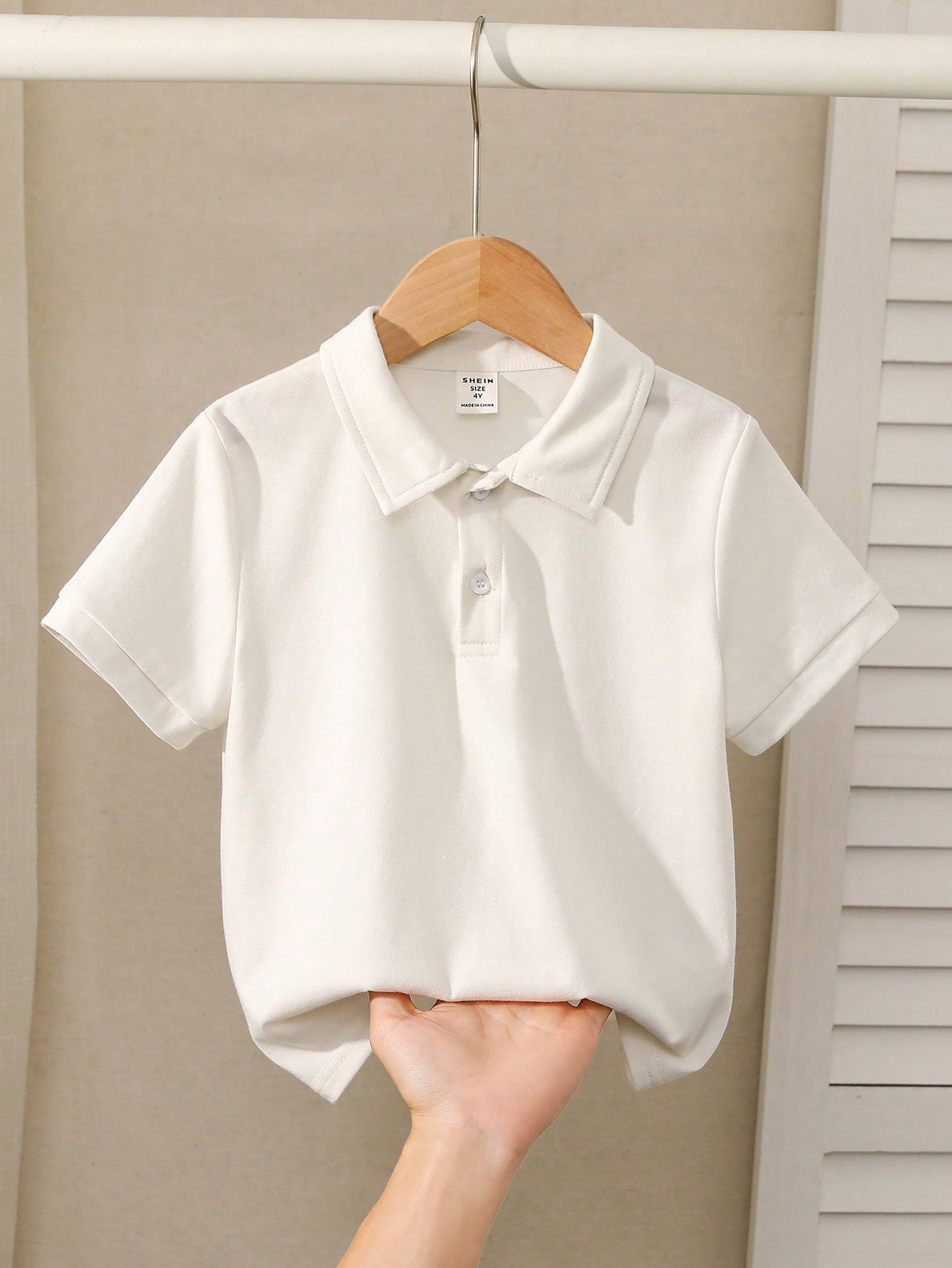 Young Boy Solid Color Knitted Short Sleeve Polo Shirt With Turn-Down Collar