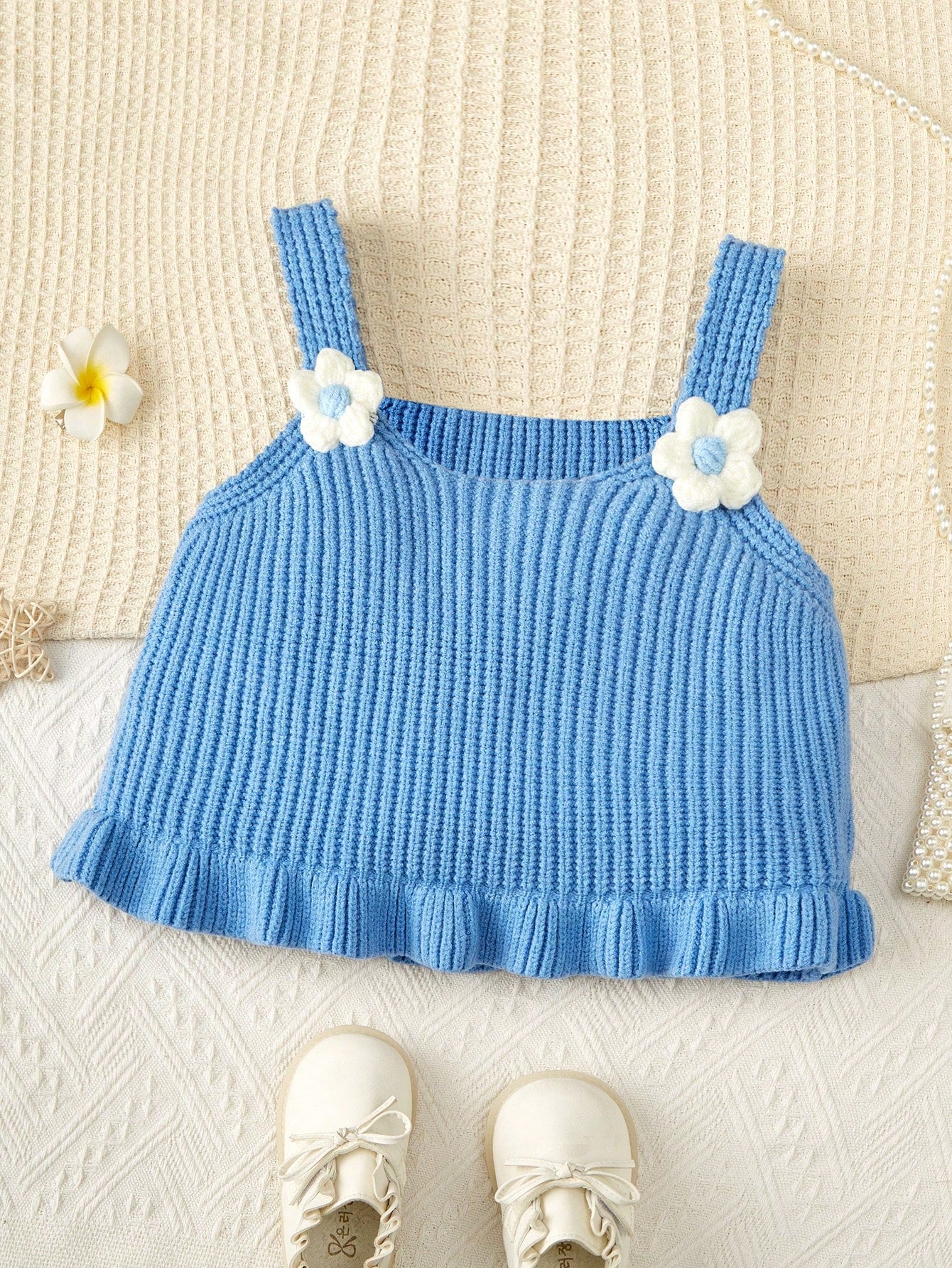 Young Girls Solid-Colored Sweater With Flower Applique, Ruffle Hem, Wide Shoulder Strap And Sleeveless Design