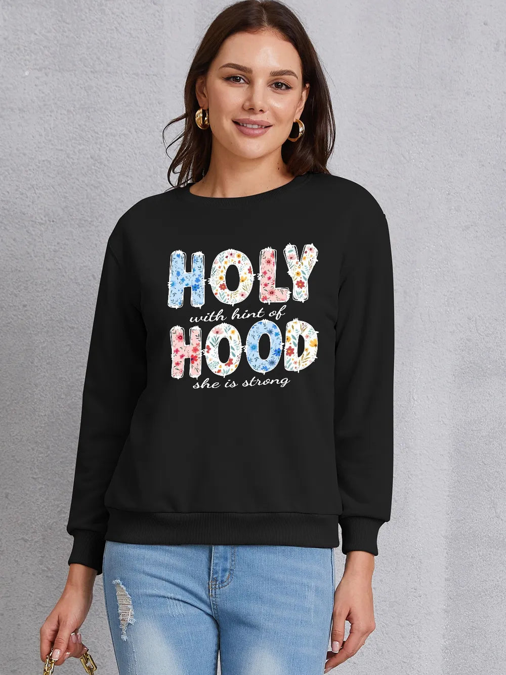 HOLY WITH HINT OF HOOD SHE IS STRONG Round Neck Sweatshirt