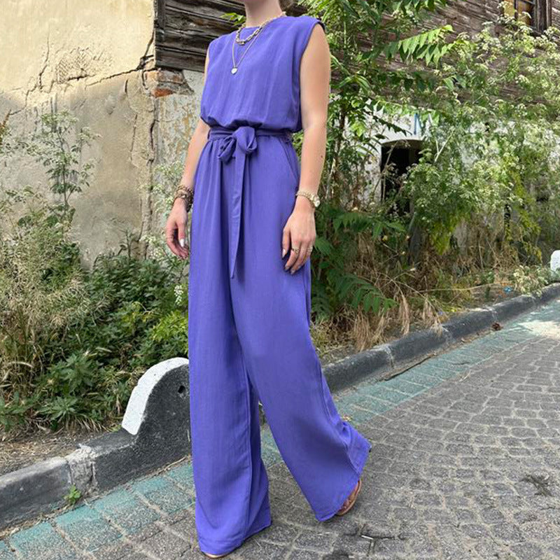 Fashionable and casual women's jumpsuit, solid color, elegant, loose-fit sleeveless design with a waist tie and wide-leg pants.