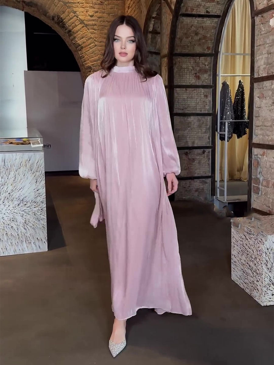 Long-sleeve pleated fairy dress with long hem and semi-high collar in shiny fabric, new Middle Eastern Arab summer collection.