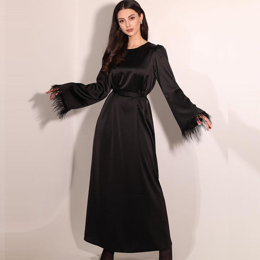 New satin elegant round-neck dress with feather stitch cuffs and long tie-up design.